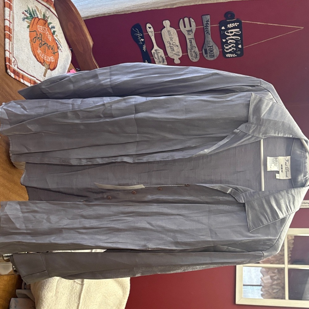 Woman’s gray button up coat